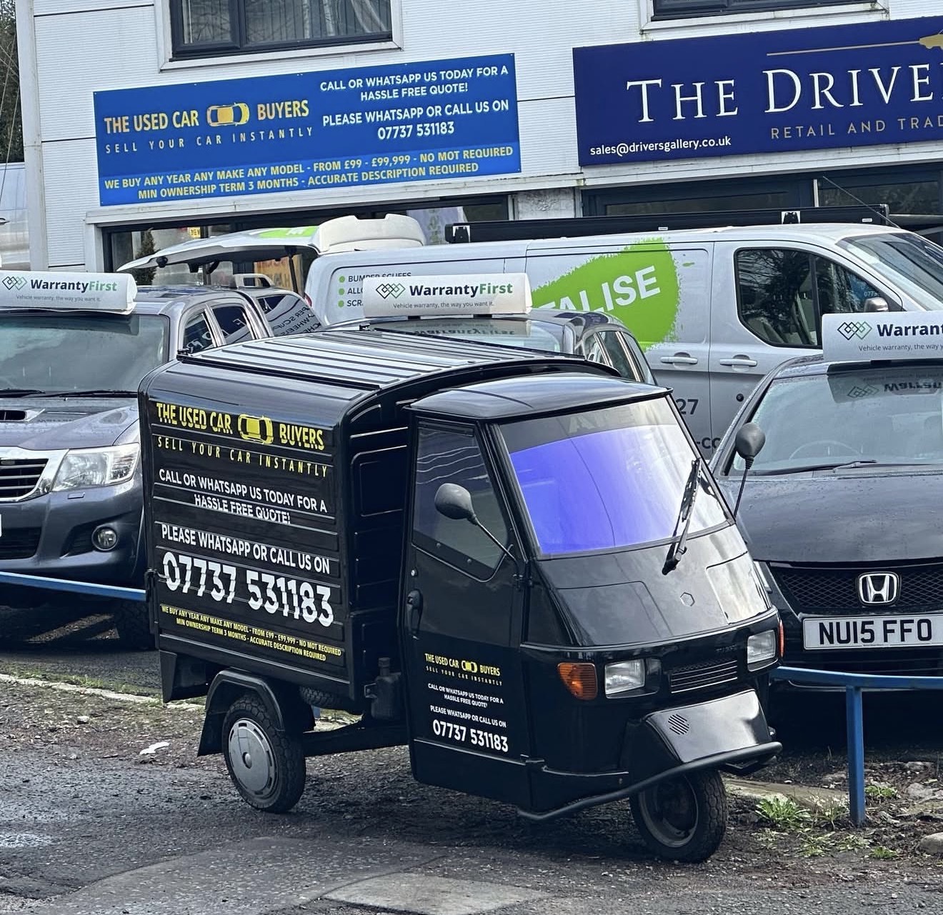 The Used Car Buyers by the showroom